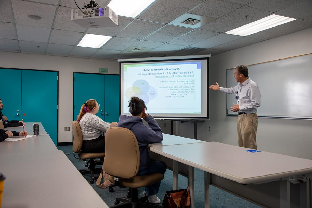 A San Juan College business professor leading a class